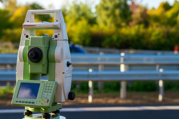 Surveyor equipment (theodolit or total positioning station) on the construction site of the...