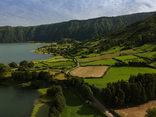 Aerial View from a beautiful lagoon surrounded by mountains. Ancient volcano crater. Seven Cities lagoon Azores Islands Portugal