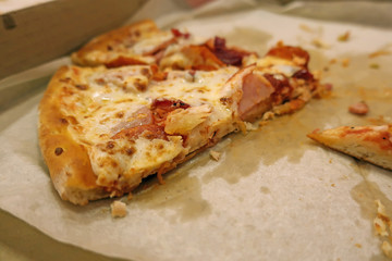 a piece of pizza in a box