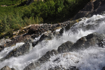 Waterfall scenes in mountains, national park Dombai, Caucasus, Russia, Europe. Sunshine weather and blue sky, summer day