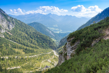 Fototapeta na wymiar Green valley with panorama of the Alps, Schladming, Austria