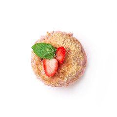 Donut with pink cream with nuts and strawberries. Top view.  Isolated image.