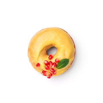 Donut glazed with honey and pomegranate. Top view.  Isolated image.