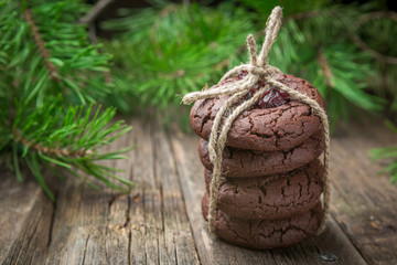 Christmas chocolate cookies with cranberry tied with twine