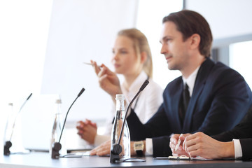Speakers at business meeting