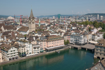 Obraz premium Zurich, Switzerland - June 19, 2017: Aerial view of historic Zurich city center and river Limmat from Grossmunster Church, Switzerland. Summer landscape