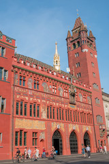 Obraz premium Basel, Switzerland - June 21, 2017: View on Basel Town Hall (Rathaus Basel), is a 500-year-old building dominating the Marktplatz. Summer day with blue sky