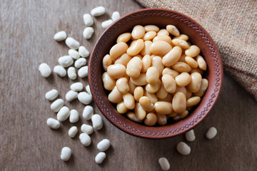 Boiled white kidney beans in a rustic bowl