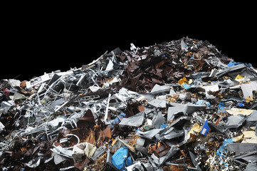 Pile of metal trash on a black background