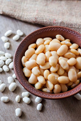 Boiled white kidney beans in a rustic bowl