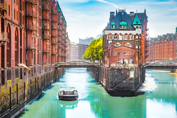 Hamburg Speicherstadt with sightseeing tour boat in summer, Germany - obrazy, fototapety, plakaty