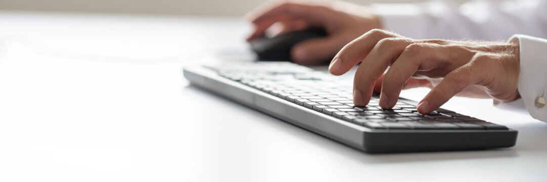 Businessman using computer keyboard