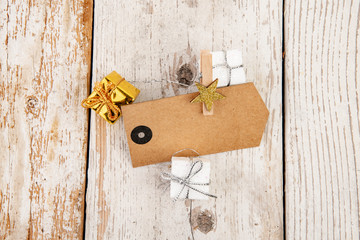 gift tag with presents on old rustic wood background