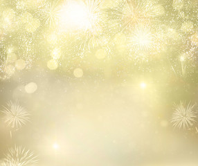 Fototapeta na wymiar Abstract festive winter golden bokeh background with fireworks and bokeh lights