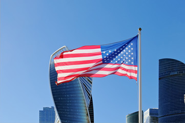 United states flag against of Moscow City skyscrapers
