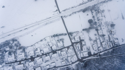 Top view of snow covered buildings.