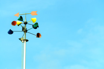 Colorful wind direction indicator on sky