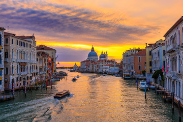 Obraz premium Grand Canal with Basilica di Santa Maria della Salute in Venice, Italy. Sunrise view of Venice Grand Canal. Architecture and landmarks of Venice. Venice postcard