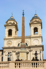 Fototapeta na wymiar Above the Spanish Steps the church of the Santissima Trinita dei Monti in Rome, Italy
