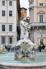 Triton in the historic Moor Fountain in Piazza Navona in Rome