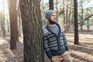 Outdoor portrait of handsome bearded man . Casual autumn fashion portrait