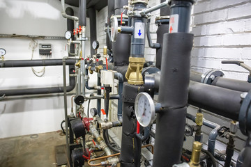 House heating system with many steel pipes, manometers and metal tubes