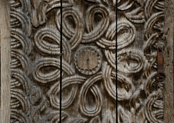 Еlement woodcarving. The pattern of flower carved on the wooden