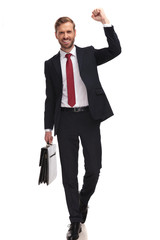 excited businessman stepping and celebrating his new job