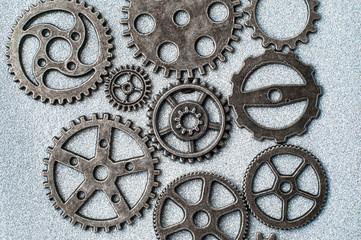 Gear wheels on glittering background