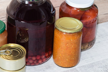 Storage shelves in pantry with homemade canned preserved fruits and vegetables