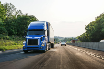 Fototapeta na wymiar Semi 18-wheeler truck on highway 