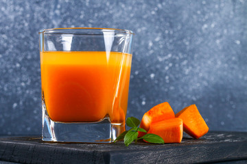 Pumpkin Smoothie Pumpkin juice on a dark table. Autumn drinks.