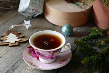 Delicious  Hot Cup of tea with christmas tree. Copy space. Christmas Background. Tea Time. Selective focus.