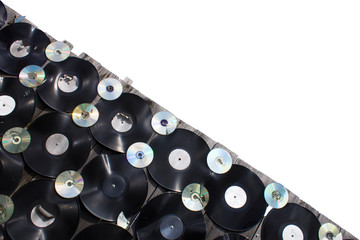 Vinyls and cd are screwed to a fence on white background, isolate