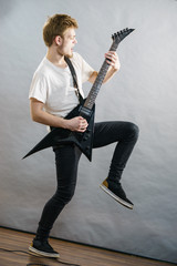 Fototapeta premium Man playing on electric guitar