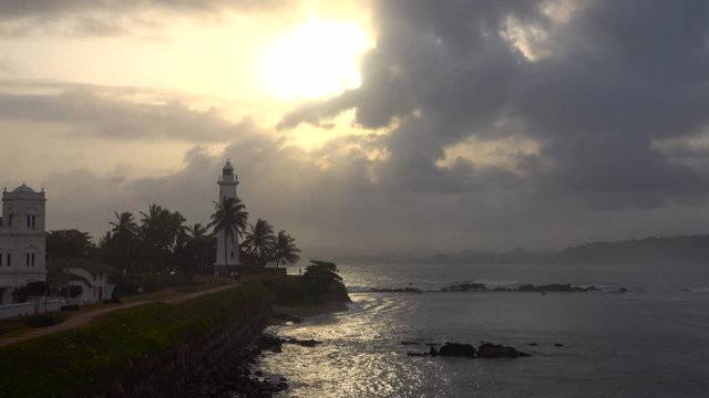 Galle fort and lighthouse at sunset in Galle, Sri Lanka