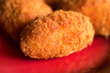 Freshly cooked breaded meat cutlets on plate
