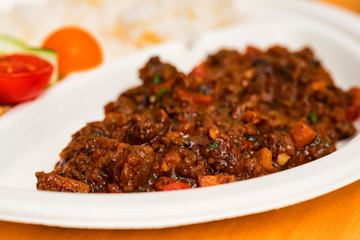 Traditional mexican chilli beans soup or chili con carne in plate