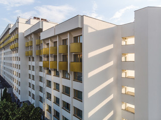 Fototapeta premium White building with yellow windows by drone