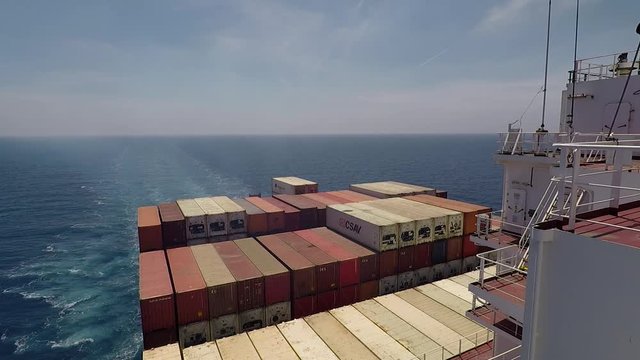 Onboard of huge Container ship during underway, aft view