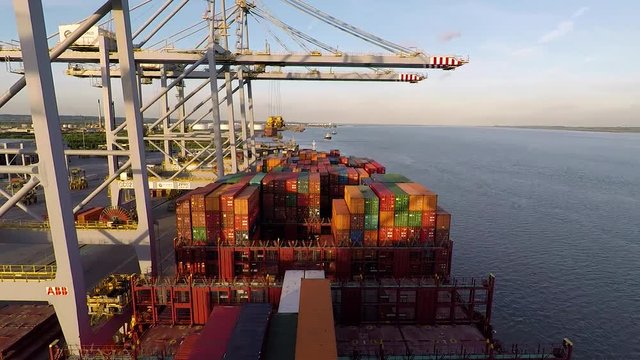 Gantry cranes work on a cargo vessel Video time-lapse