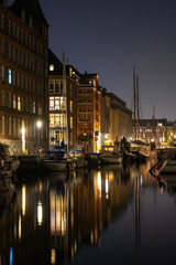 Cozy christianshavn channel in the danish capital of Copenhagen. This is the harbor for many liveaboard and boats made for housing