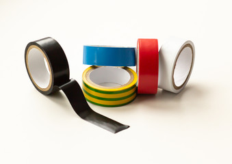Multicolored insulating tape on a white background, close-up