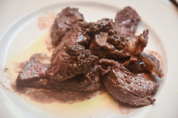 Fried beef in truffle sauce.
