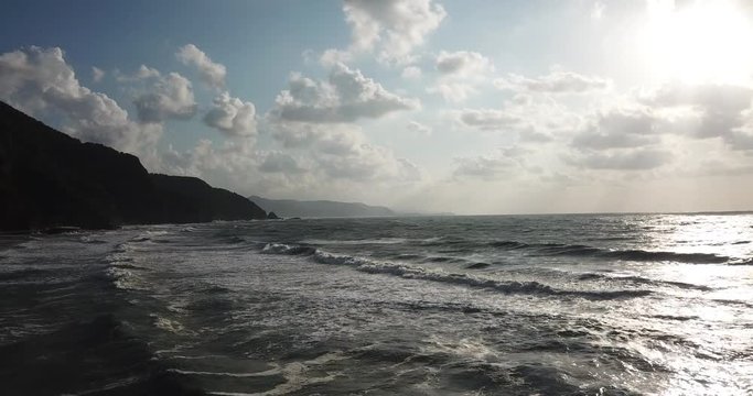 Shot of a beautiful summer sunset at the beach. Sunset at sea drone footage