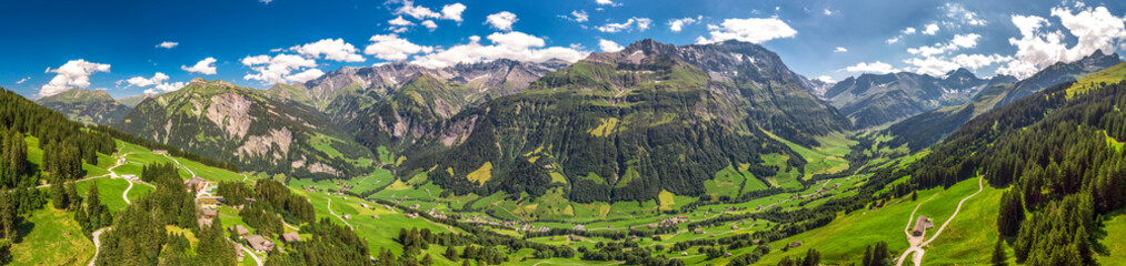 Aerial view of Elm village and Swiss mountains - Piz Segnas, Piz Sardona, Laaxer Stockli from...