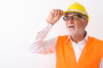 Close up of handsome senior bearded man construction worker thin