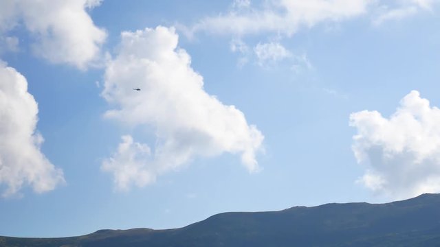 Helicopter flies in the sky