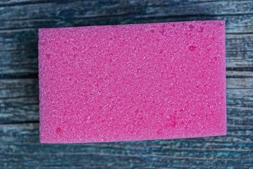 one red foam sponge on the table