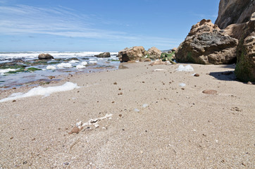 maritime landscape of rocks at the base of the cliff
